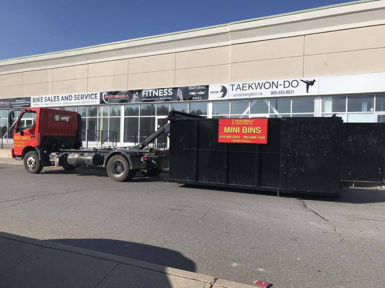 truck pulling a big bin