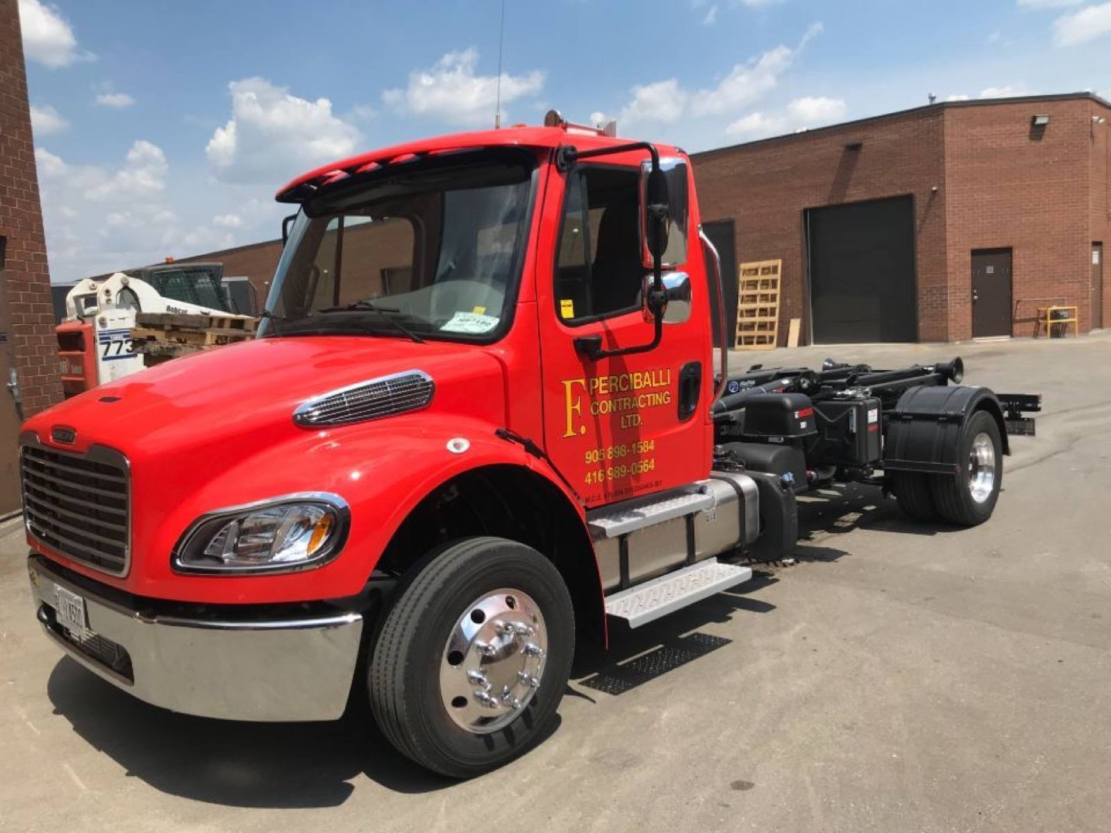 side view of mini bin modified truck