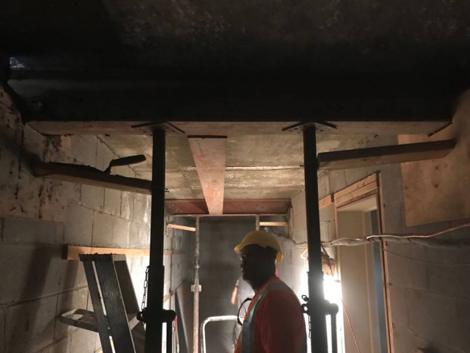 worker looking at the structure 