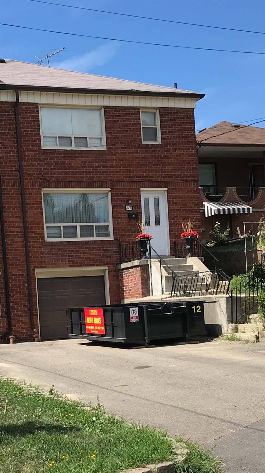 dust bin placed in front of a house