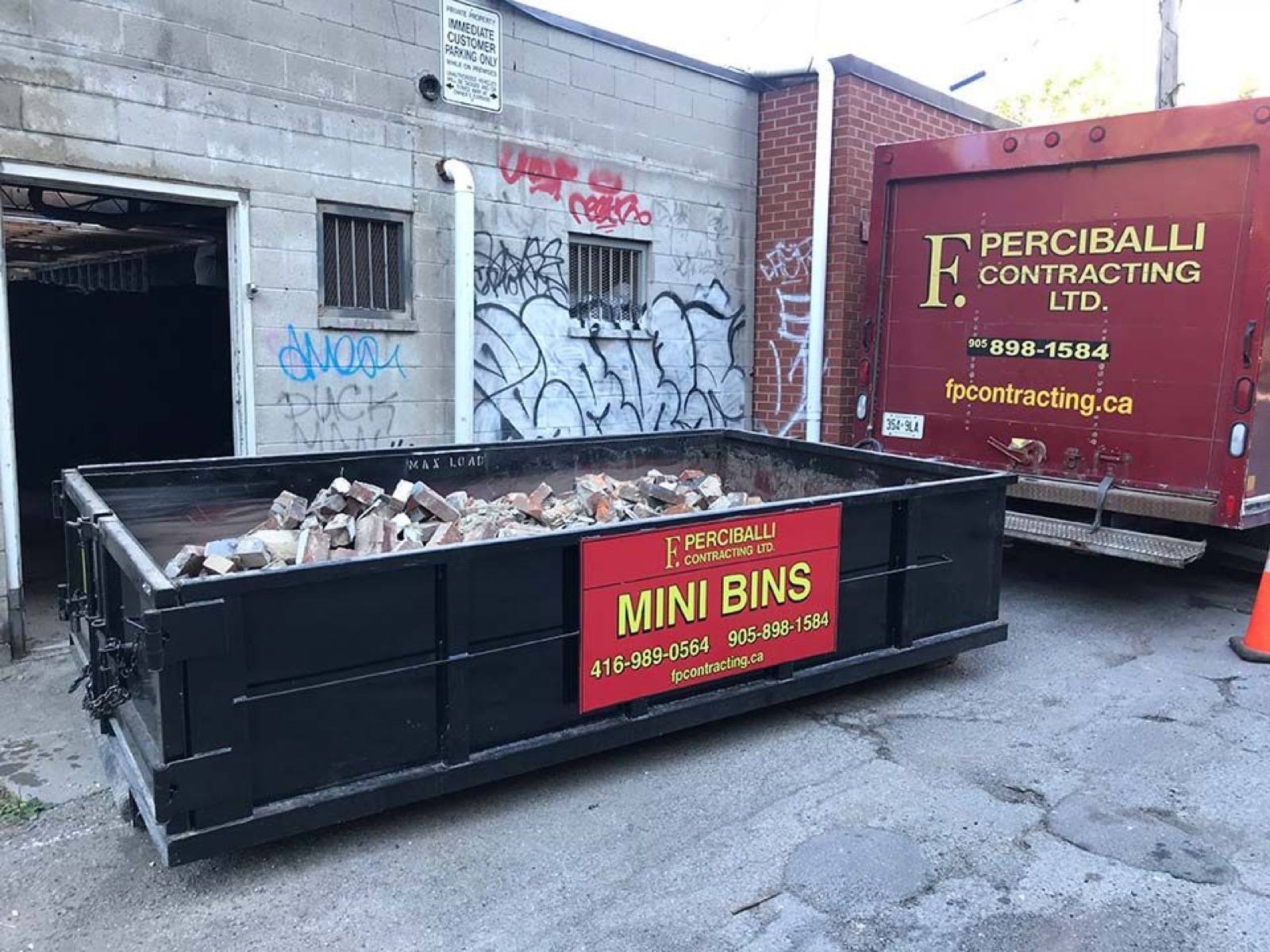 View of a black colour dust bin filled with waste 