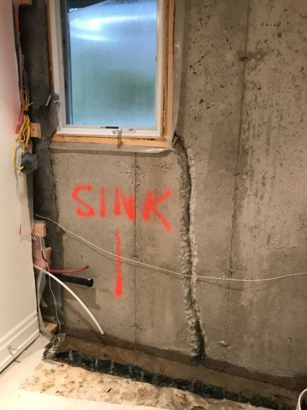 deep crack appeared in the concrete wall