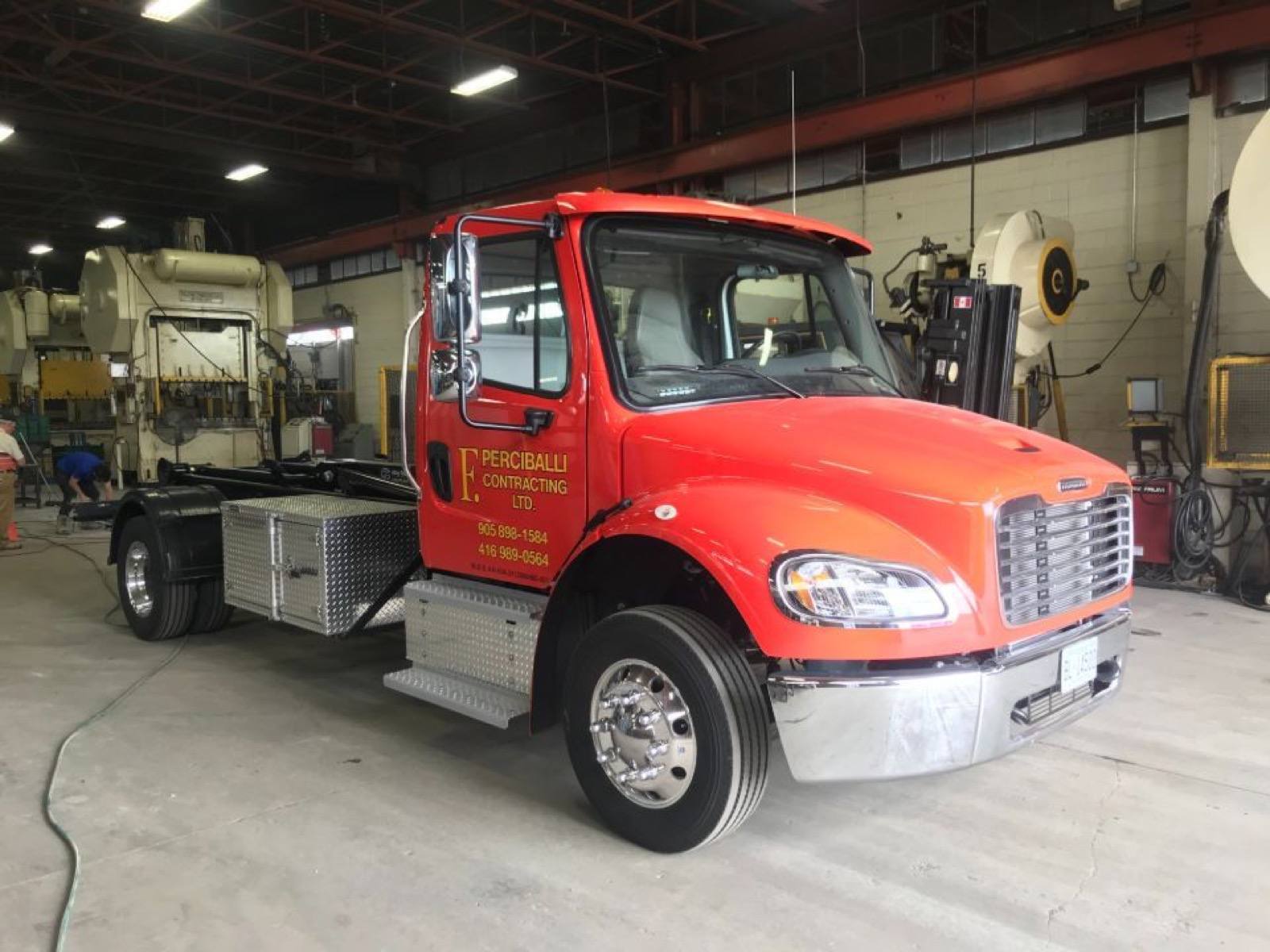 close up view of mini bin truck in a ware house